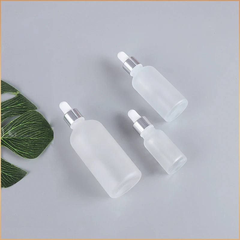 Nachfüllbare Tropfflasche/Pipette aus klarem Glas mit silberner Kappe zum Nachfüllen von Massageölen, Aromatherapie-Flüssigkeit, Essenz/Serum, Hautpflege